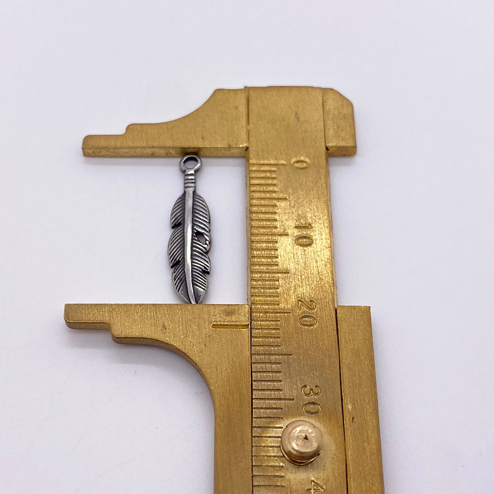 PC474 Feather charm